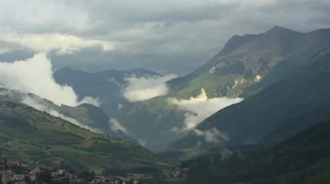 Valley + low clouds in Swiss Alps - Unterengadin Scuol Stock Footage 34404735
