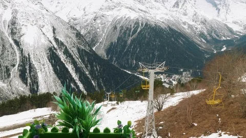 Valley of mountain and functioning old chairlift in mountains without snow 動画素材 102483525