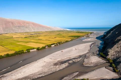 Valley of Ocona River as it flows into the Pacific ocean in the Arequipa Re.. Stock Photos