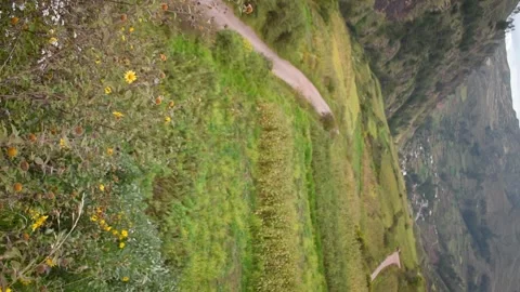 Valley with a road to a town with mountains Stock Footage 274512979