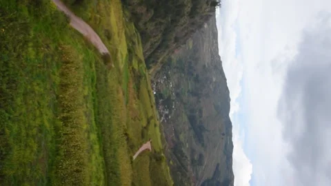 Valley with a road to a town with mountains Stock Footage 274512982