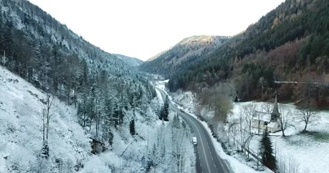Valley road in a wintry landscape Stock Footage 292915468