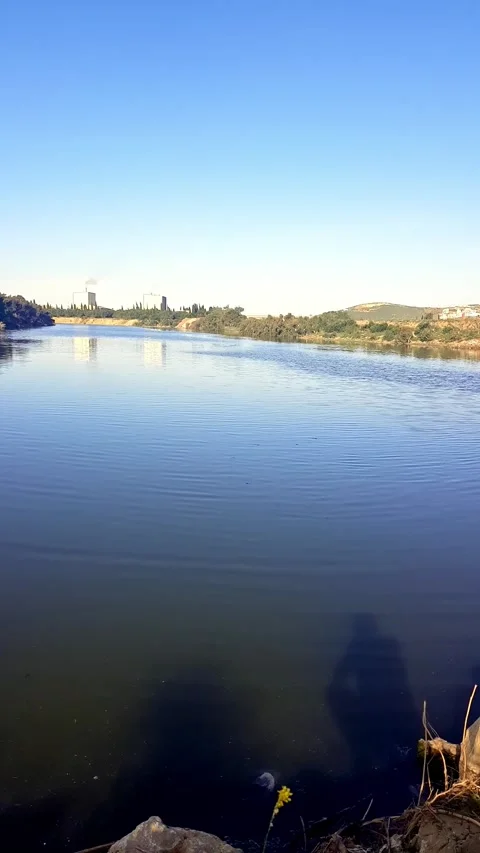 Valley scene with warm glow on the surface of the valley water on a sunny day Stock Footage 281792358