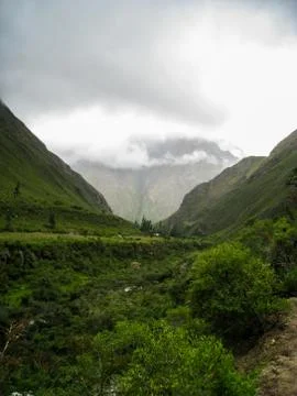 A valley view between mountains. Stock Photos
