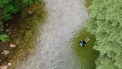 A valley where clear water flows to swim coolly in the hot summer, drone_11 Stock Footage 280179055