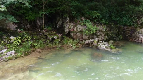 A valley where clear water flows to swim coolly in the hot summer,drone_8 Stock Footage 280179069