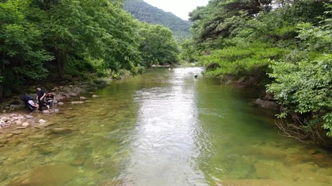 A valley where clear water flows to swim coolly in the hot summer_25 Stock Footage 280179123