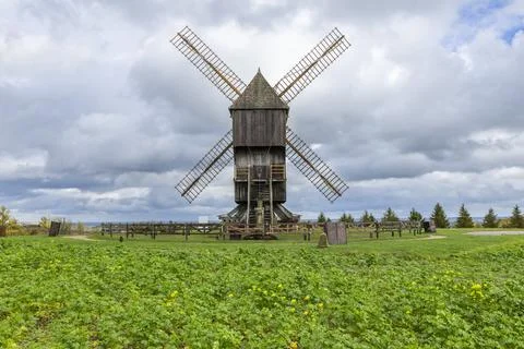 Valmy windmill standing in green field with clouds Stock Photos