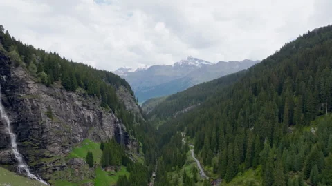 Vals - Cinematic view over its Alpine Dam Stock Footage 312698873