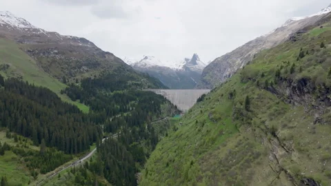 Vals - Cinematic view over its Alpine Dam Stock Footage 312699089