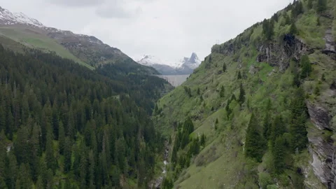 Vals - Cinematic view over its Alpine Dam Stock Footage 312699395