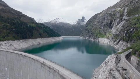 Vals - Cinematic view over its Alpine Dam Stock Footage 312700259
