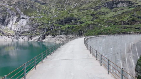Vals - Cinematic view over its Alpine Dam Stock Footage 312700452