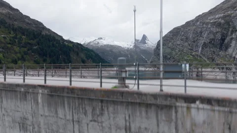 Vals - Cinematic view over its Alpine Dam Stock Footage 312700478