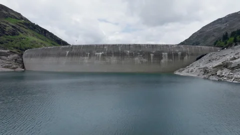 Vals - Cinematic view over its Alpine Dam Stock Footage 312701034
