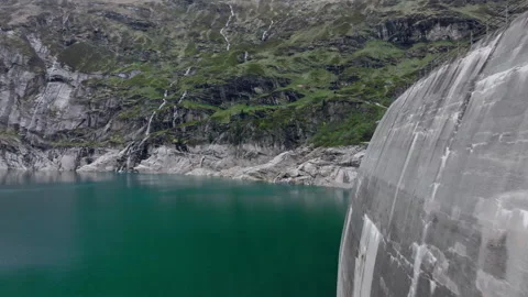 Vals - Cinematic view over its Alpine Dam Stock Footage 312701093