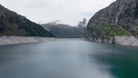 Vals - Cinematic view over its Alpine Dam Stock Footage 312701523