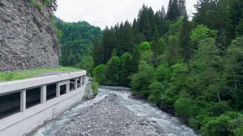 Vals - Cinematic view over its Alpine Dam Stock Footage 312701669