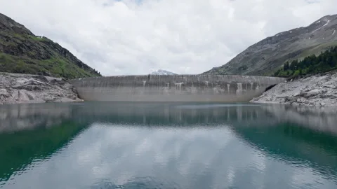 Vals - Cinematic view over its Alpine Dam Stock Footage 312723871
