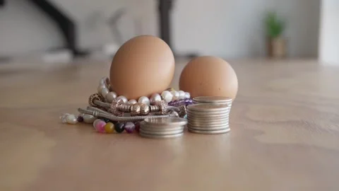 Valuable Easter eggs with coins Stock Footage 304189192