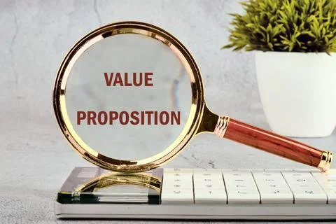 Value added concept. Words VALUE PROPOSITION on a gray background standing .. 스톡 사진