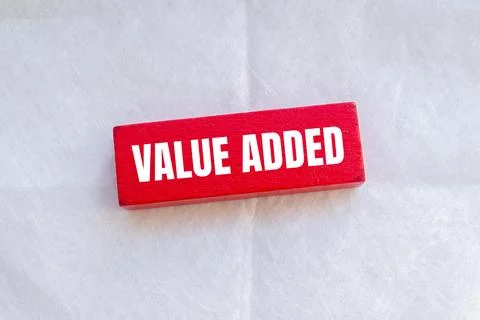 Value added message written on red wooden block with white background. Conc.. 写真素材