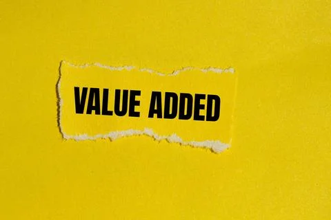 Value added message written on ripped yellow torn paper piece with yellow b.. 写真素材
