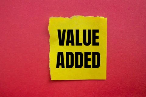 Value added message written on ripped torn yellow paper piece with red back.. 스톡 사진