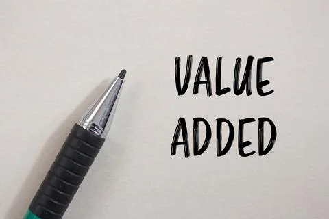 Value added message written on white paper with a pen. Conceptual value add.. Stock Photos