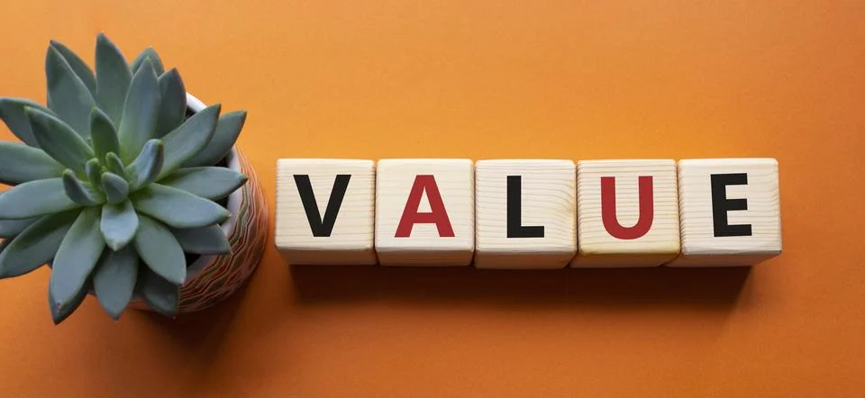Value symbol. Concept word value on wooden cubes. Beautiful orange backgrou.. 写真素材