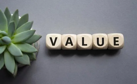 Value symbol. Concept word value on wooden cubes. Beautiful grey background.. 写真素材