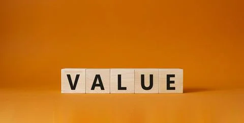 Value symbol. Concept word value on wooden cubes. Beautiful orange backgrou.. Stockfoto's