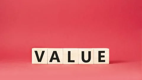 Value symbol. Concept word value on wooden cubes. Beautiful red background... Stock Photos