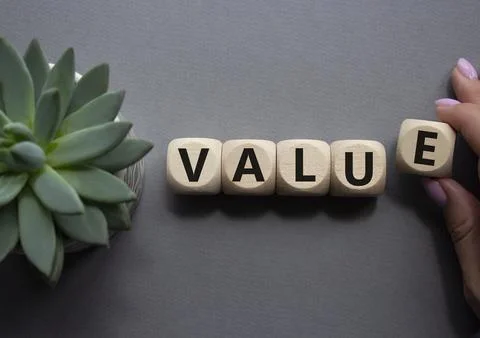 Value symbol. Concept word value on wooden cubes. Businessman hand. Beautif.. Stock Photos