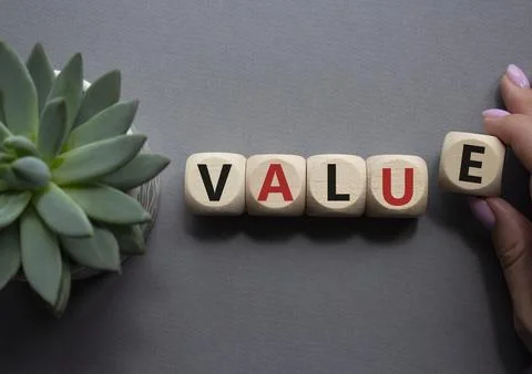 Value symbol. Concept word value on wooden cubes. Businessman hand. Beautif.. Stock Photos