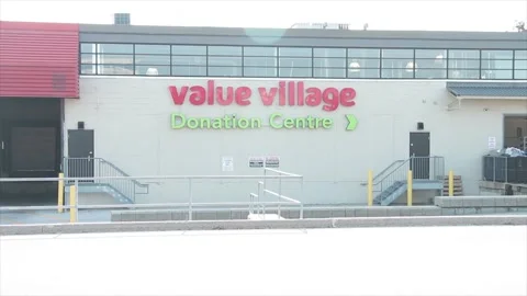 Value village donation centre center sign logo on back of store with railings Stock Footage 251362525