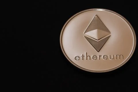 Valueable silver ether coin from cryptocurrency on black large Stock Photos