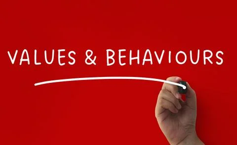 Values and behaviour text on red cover background. Conceptual Stock Photos