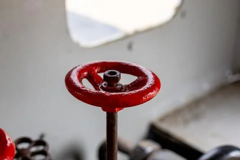 Valve with handle on metal pipework for control and maintenance. Stock-Fotos