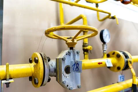 The valve of the heating system in close-up in the boiler room. Stock Photos