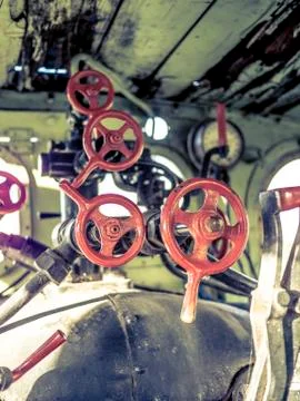 Valves in an old steam machine Stock Photos