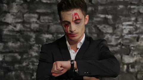 Vampire looks at the clock and angry Stock Footage 252025885