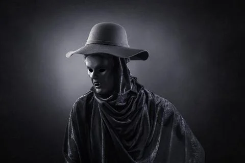 Vampire with old hat over dark misty background Stock Photos