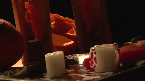 Vampire table with bloody teeth, candles and scary Jack O' Lantern pumpkin Stock Footage