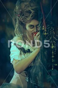 Vampires. Bloodthirsty female vampire in the old abandoned castle. Vintage st Stock Photos