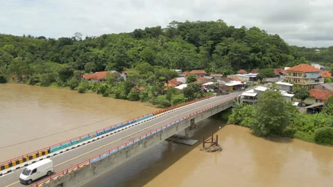Van And Motorcycle Cross Bridge In Sindangbarang Town West Java Indonesia Drone Stock Footage 334138458