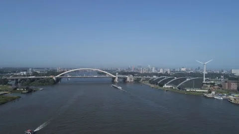 Van Brienenoord Bridge is a large twin tied-arch motorway bridge in Holland Stock Footage 113214348