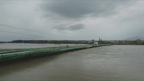 Van crossing a temporary pontoon bridge over a river Stock Footage 330566480