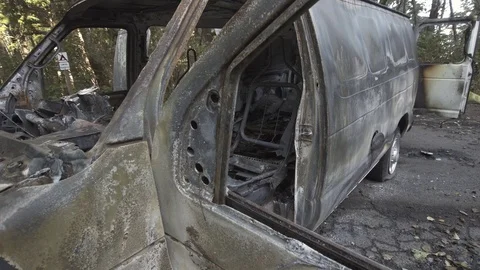 Van destroyed in a car fire Stock Footage 84223897