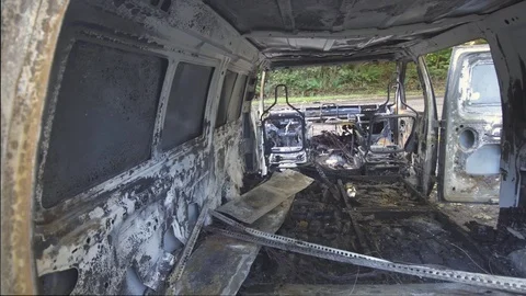 Van destroyed in a car fire Stock Footage 84224053